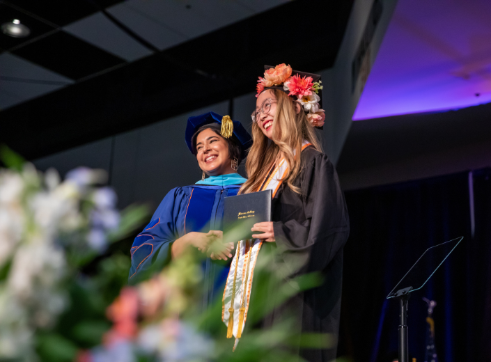 Casey Chang receives degree from college president