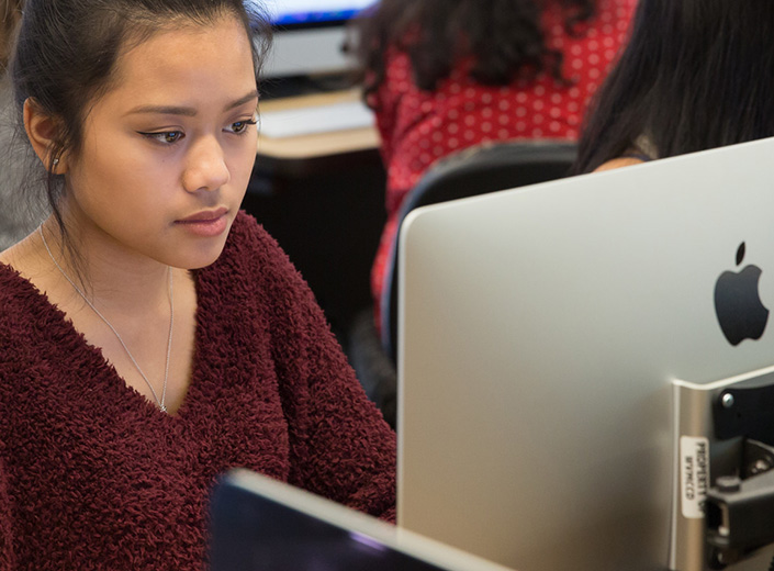 Young woman at a computer.