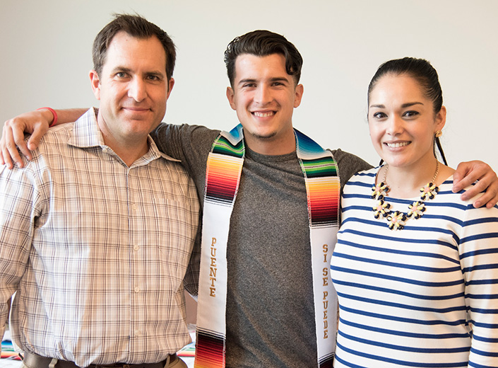 male student with two staff members