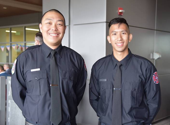 Two Asian-American male Veterans in uniform at an event.