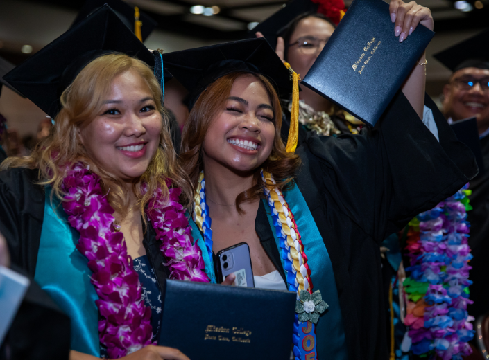 Smiling students at graduation